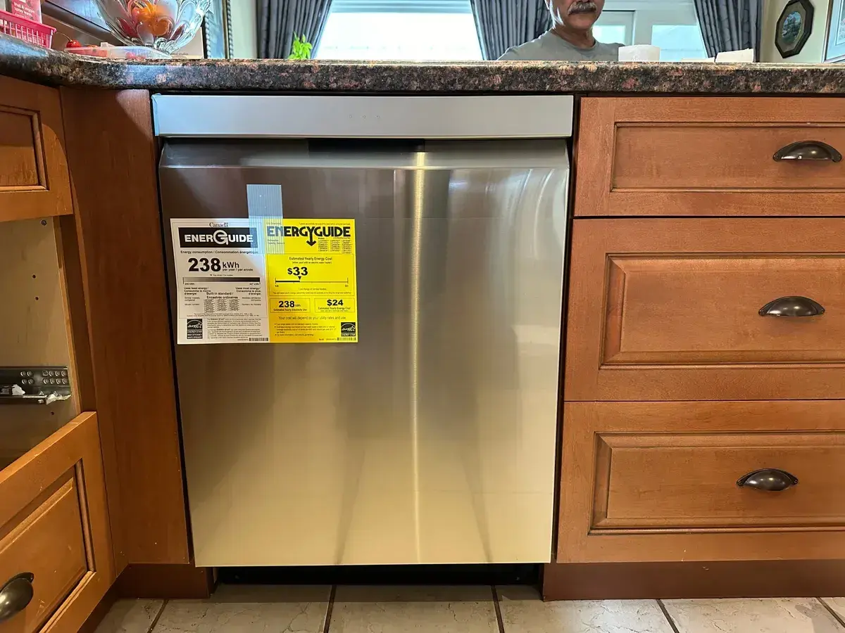 Dishwasher installed flush in cherry cabinetry
